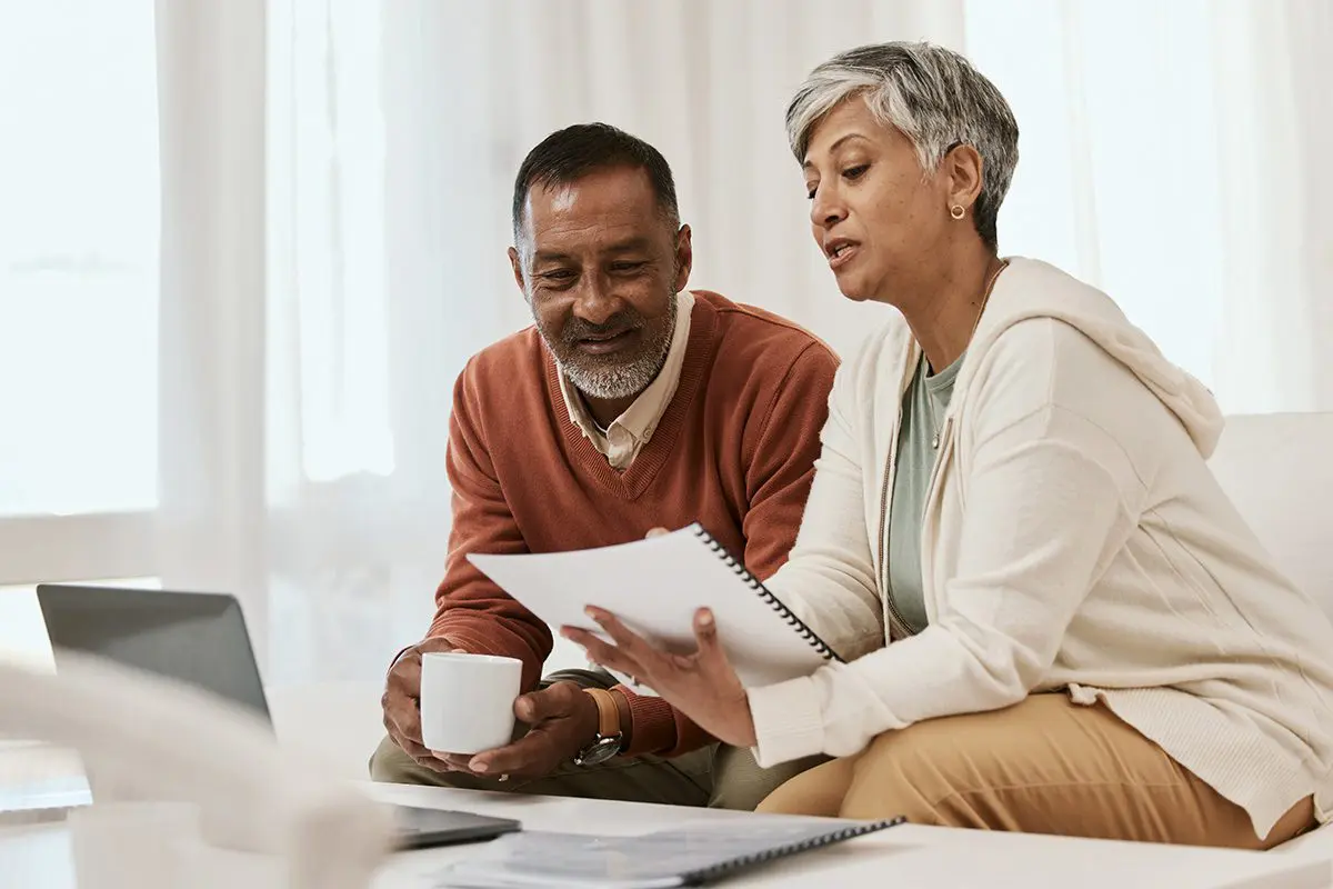 SeniorCoupleLookingAtRetirementDocuments