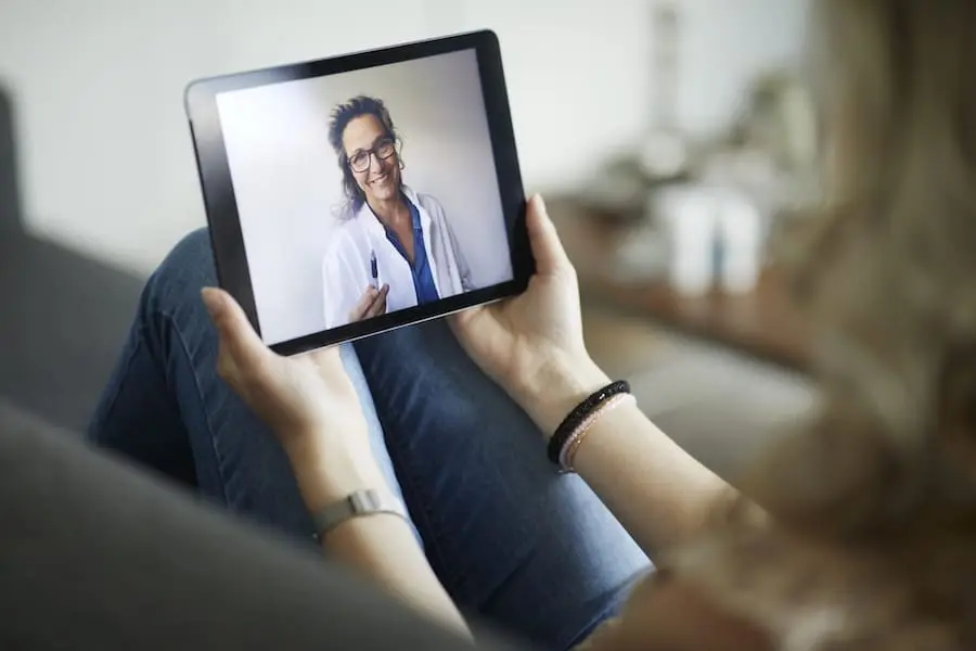 Young Woman Having Online Meeting With Female Healthcare Person