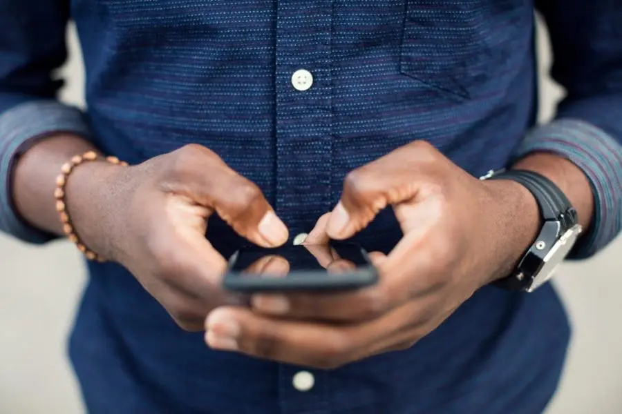 Man holding cell phone in his hands