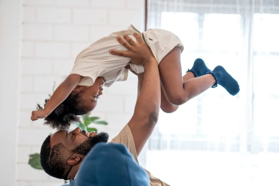 Man playing with his young daughter