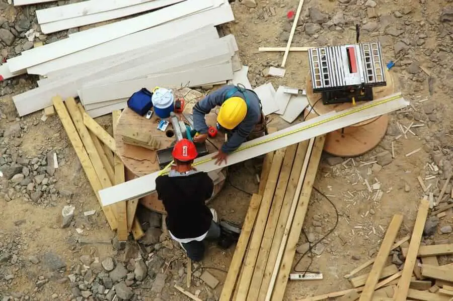 Two lawyers are discussing about contract paper, law matters determination, pointing.law and hammer on the table