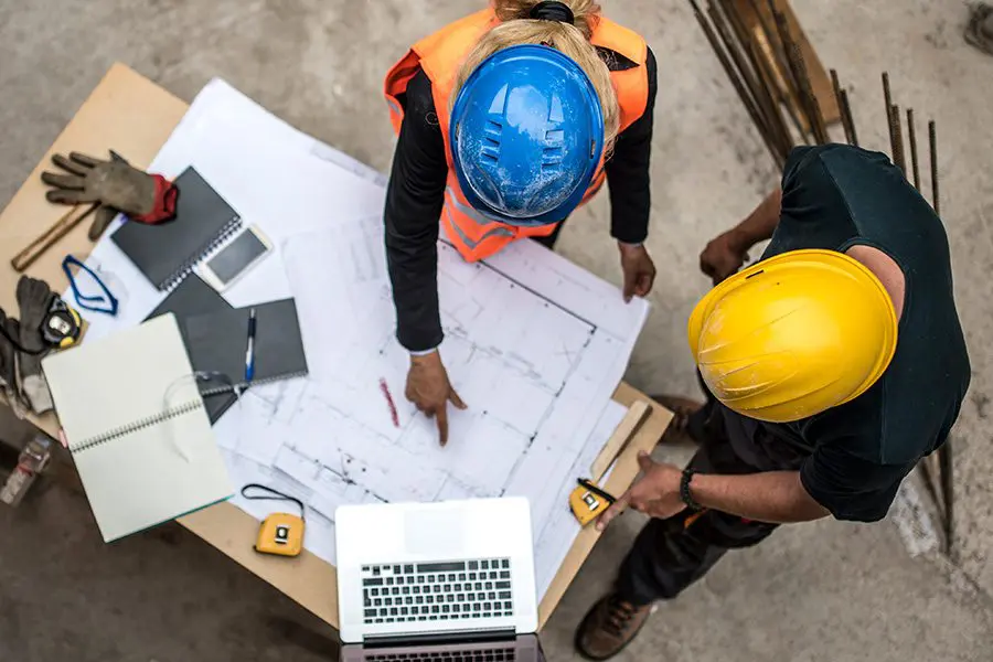 ConstructionWorkersLookingAtBlueprints