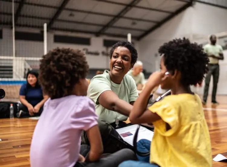 Army doctor playing with refugee children