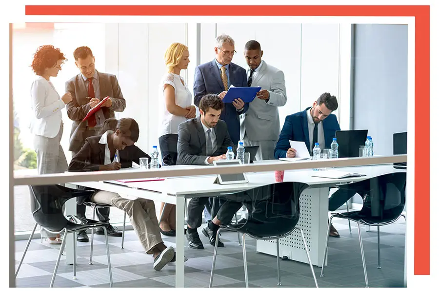 CorporateGroupofPeopleDiscussingPaperwork