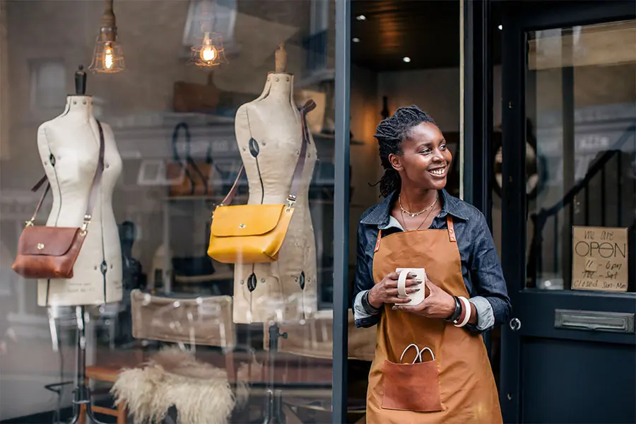 SmallBusinessOwnerOutsideHerShop