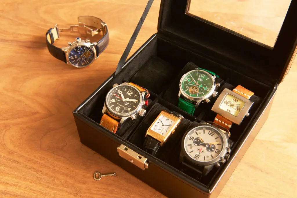 Box storing a collection of mens luxury watches