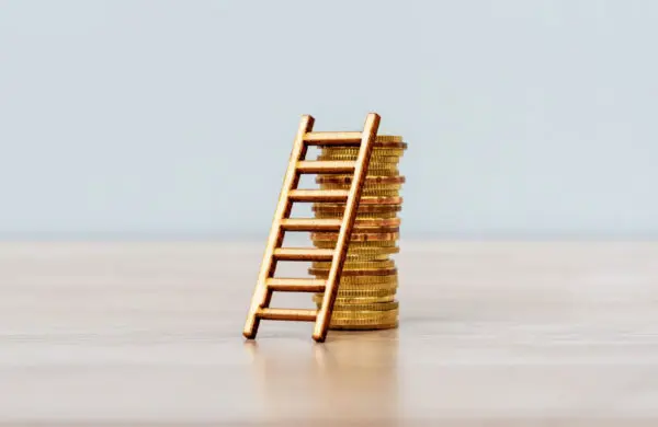 Ladder over stack of gold coins