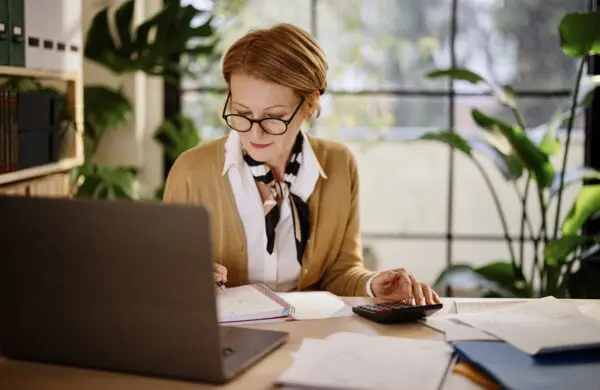Mature businesswoman using laptop while working from home