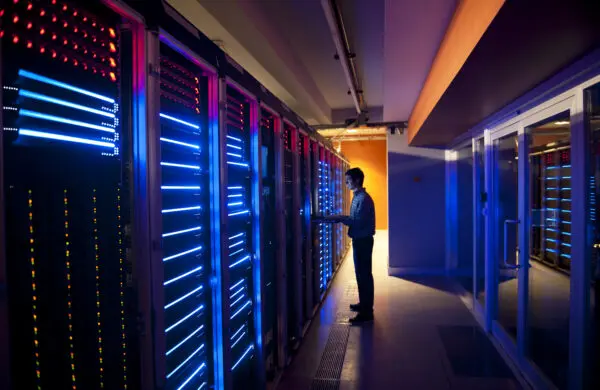 IT engineer in a modern interior of a server room in data center
