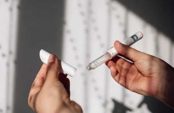 Semaglutide injection pen or cartridge pen for diabetics and weight loss in female hand