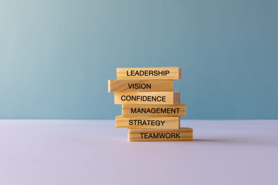 Stacked blocks with the words leadership, vision, management, strategy and teamwork