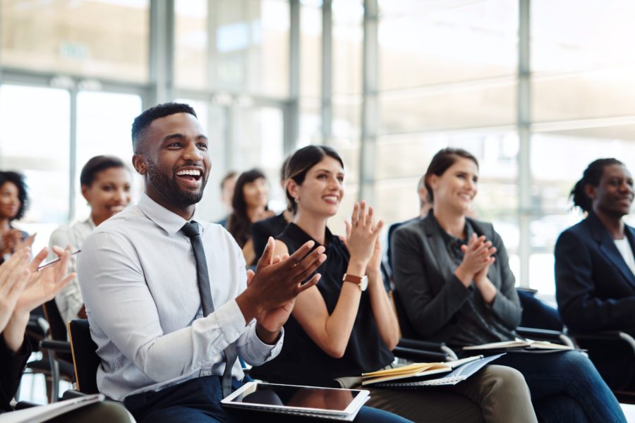 man-applauding-in-meeting-about-risk-technology