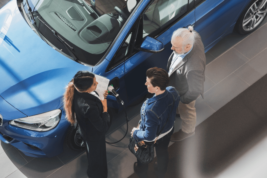 people-shopping-for-cars-at-auto-dealer