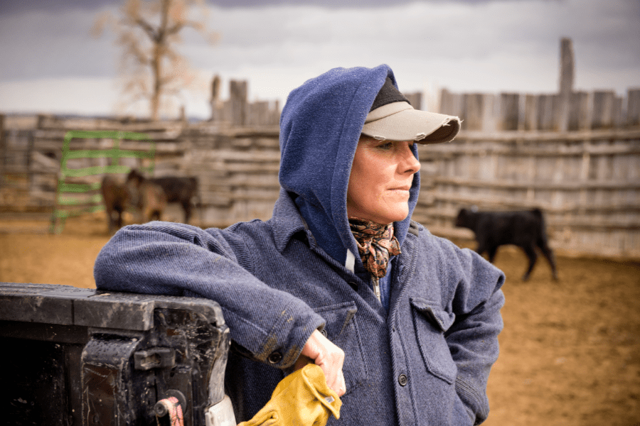 farmworker-leaning-in-field