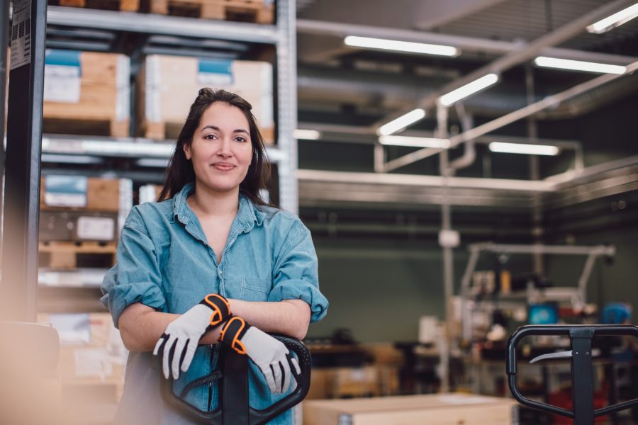 industry-working-woman-smiling-at-camera