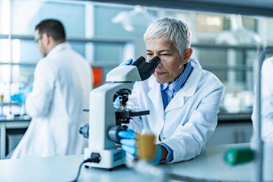 A scientist using a microscope