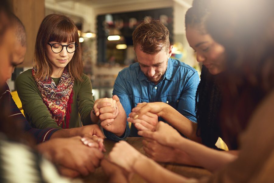 People Holding Hands In Prayer