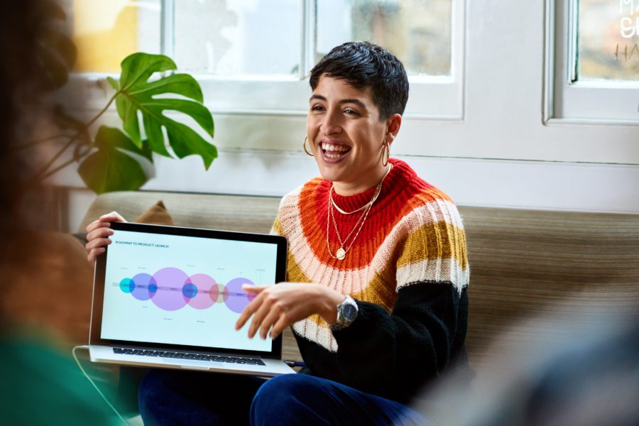 female-HR-consultant-showing-laptop-screen