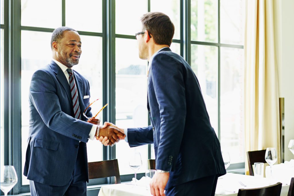 Two business partners shaking hands