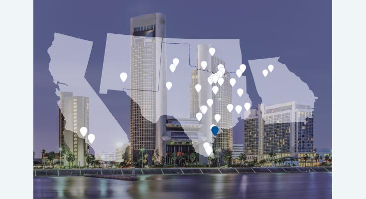A cityscape background highlights a map of several U.S. states, with numerous location markers indicating various points of interest and showcasing the dynamic reach of Borden Insurance in Corpus Christi.