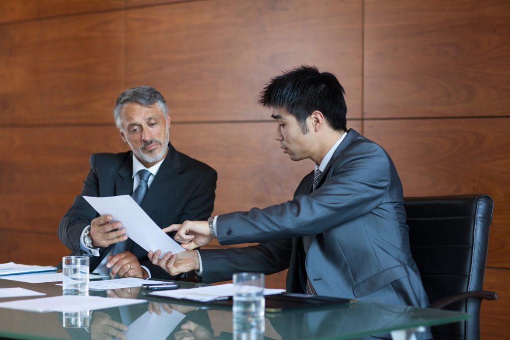 two men reviewing a contract