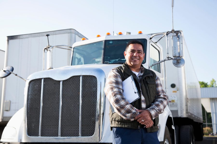 Man standing outside his semi truck