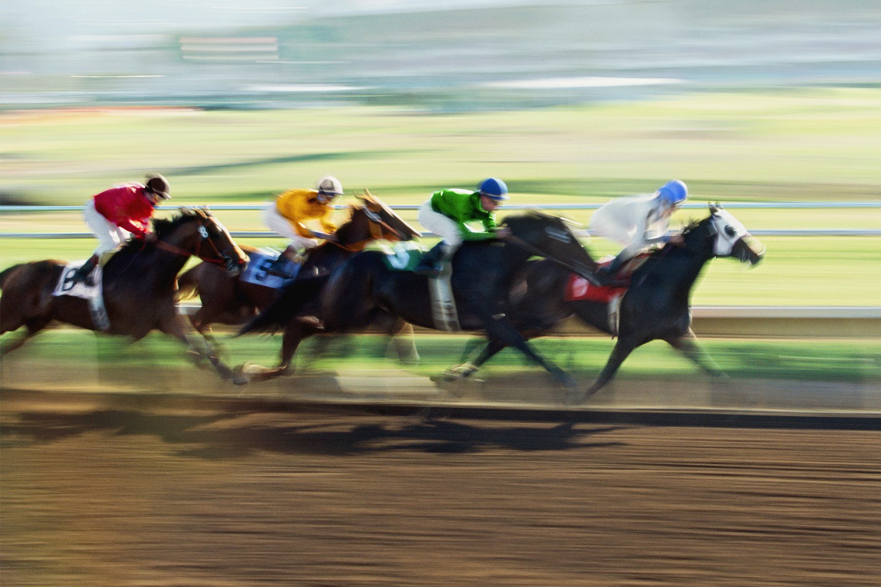Blurred image of horses racing