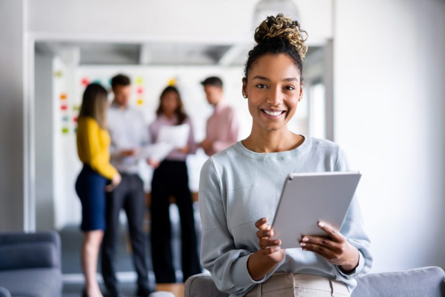 happy employee on tablet