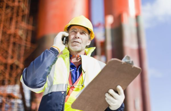 oil rig worker on the phone