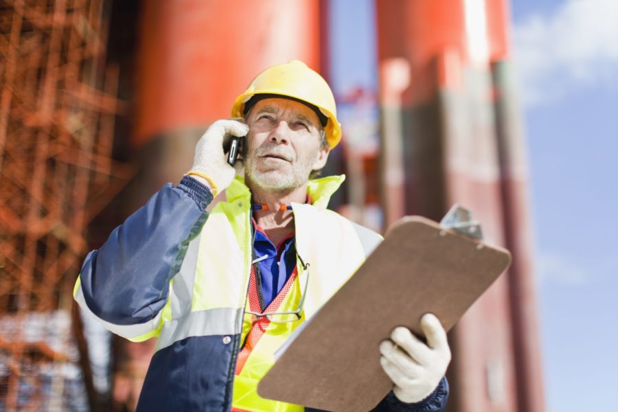 oil rig worker on the phone