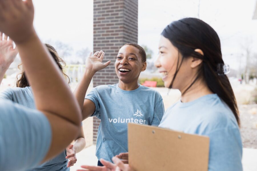 The young adults cheer each other on while announcing accomplishments they made today at the event.