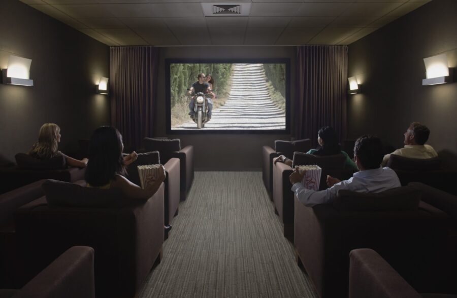 people watching a screen in a home theater 