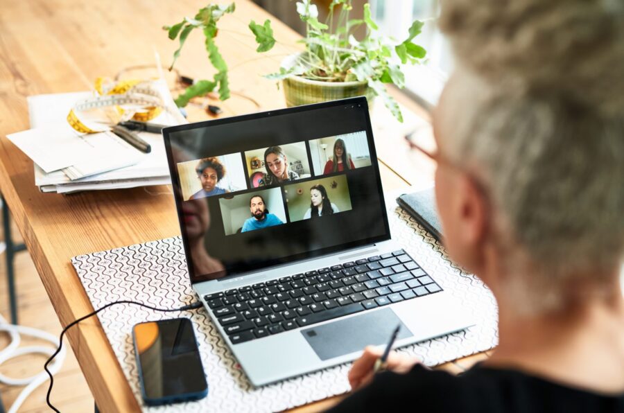 Business owner discussing ideas with colleagues on video call, communication, brainstorming