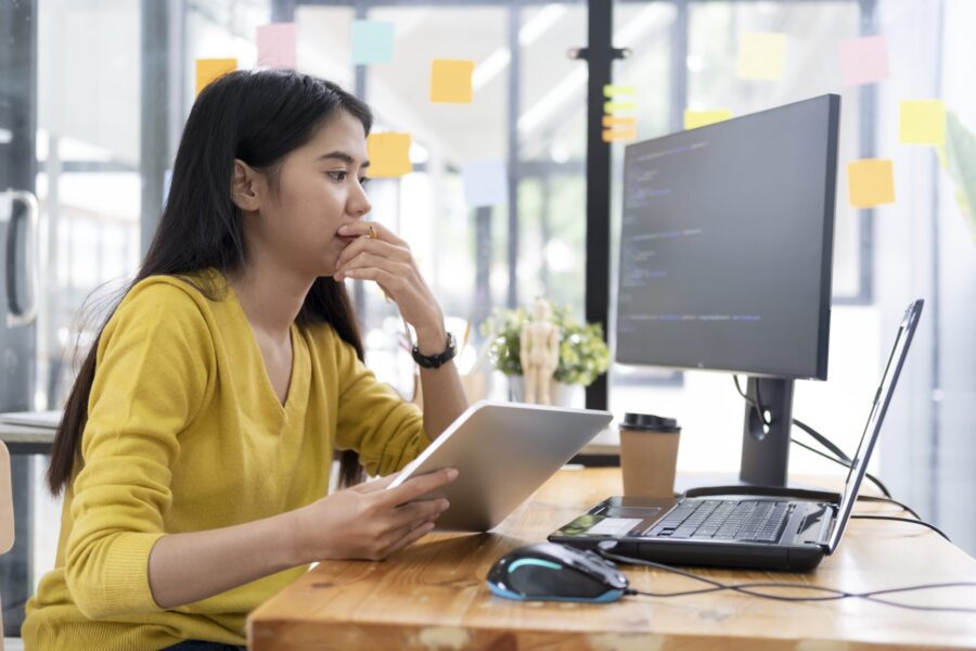 woman sitting at computer desk