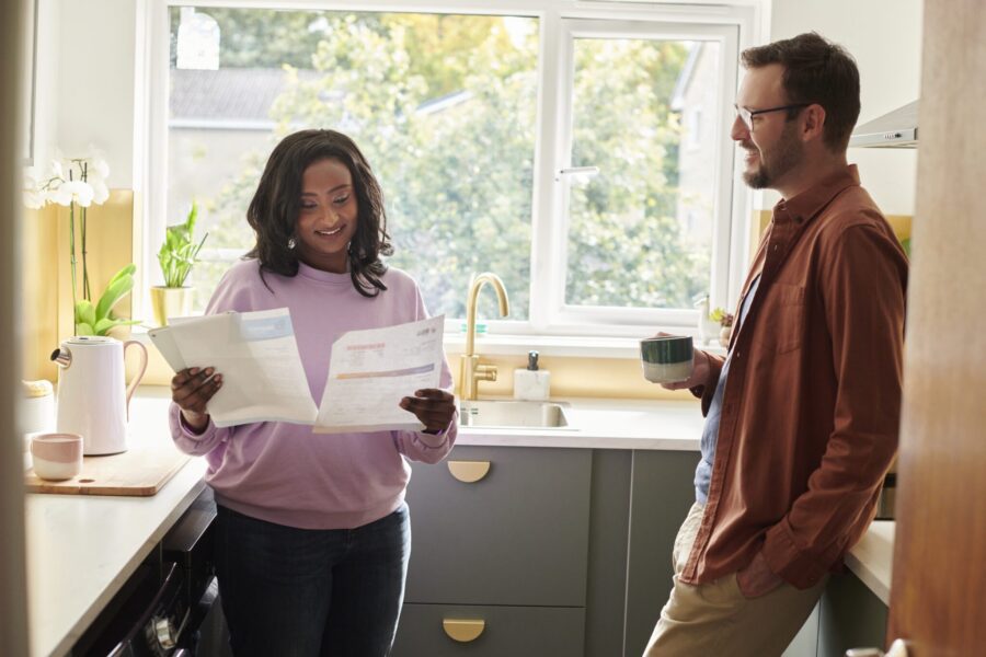 young couple looking at the bills