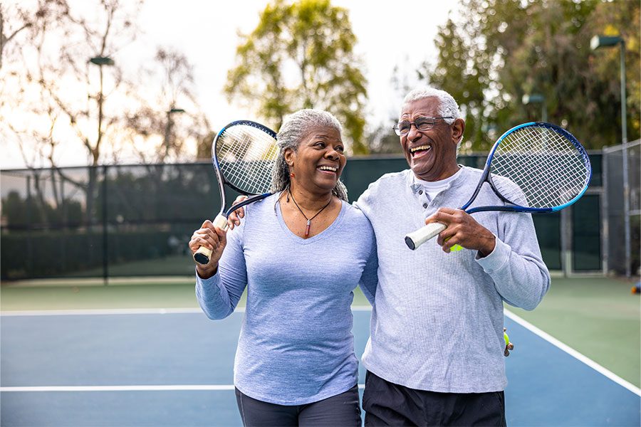 SniorCoupleOnTennisCourt