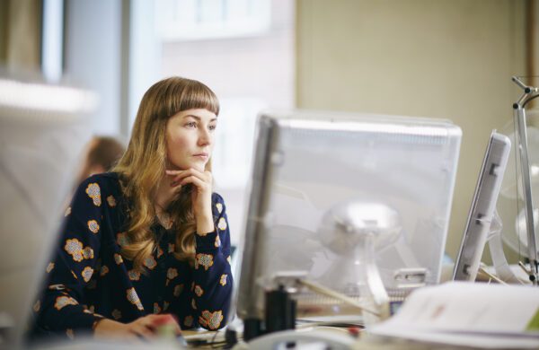 woman looking at computer