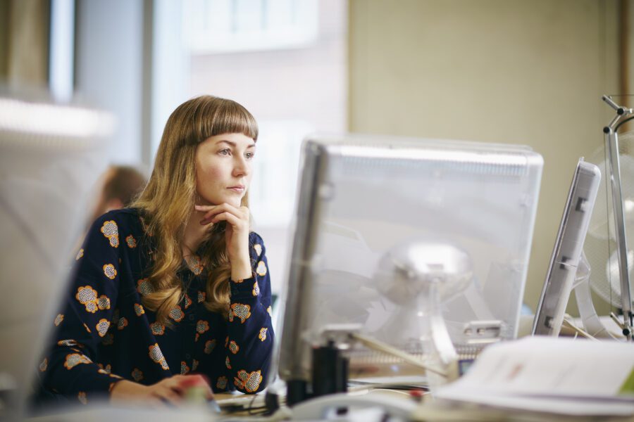 woman looking at computer