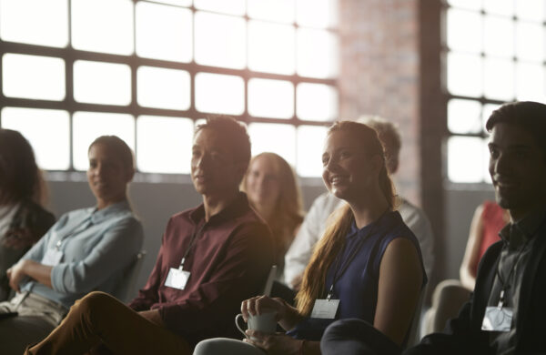 Large group of business people at lecture in New York style auditorium