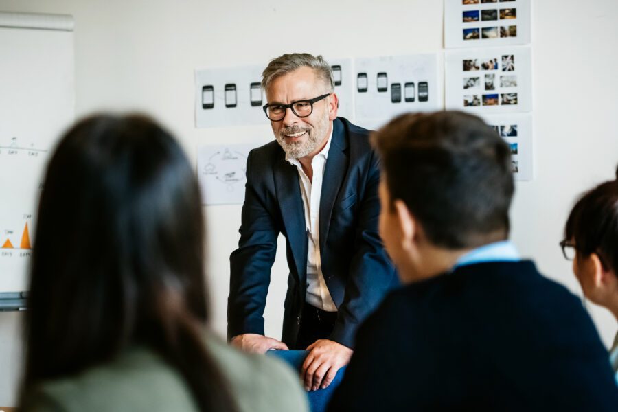 Mature businessman speaking in an informal meeting