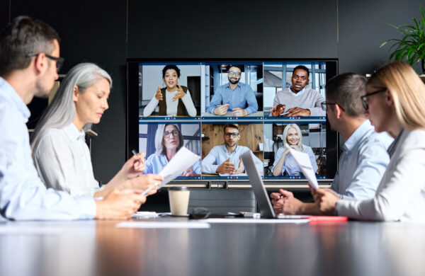 how do you write a human resources business plan Global corporation online videoconference in meeting room with diverse people sitting in modern office and multicultural multiethnic colleagues on big screen monitor. Business technologies concept.