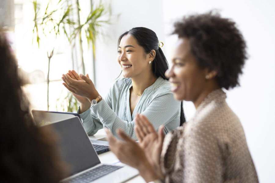 Successful business team is clapping their hands, celebrating the performance of new product