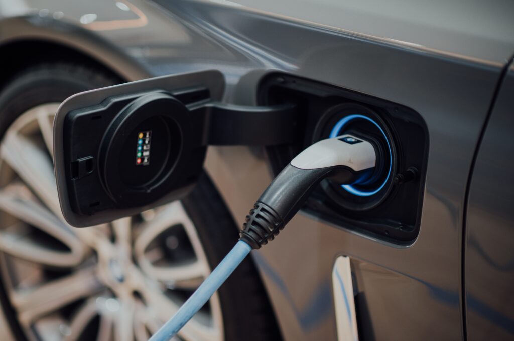 Electric car charger plugged into an electric vehicle