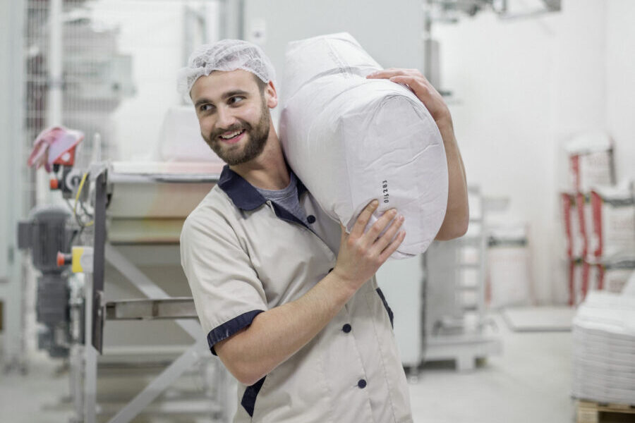 Worker In Modern Grain Mill
