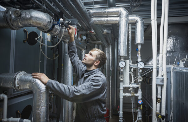 Technician with air handling and conditioning unit