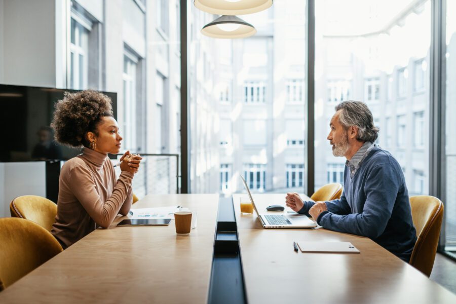 Business people dressed in smart casual clothing working in office