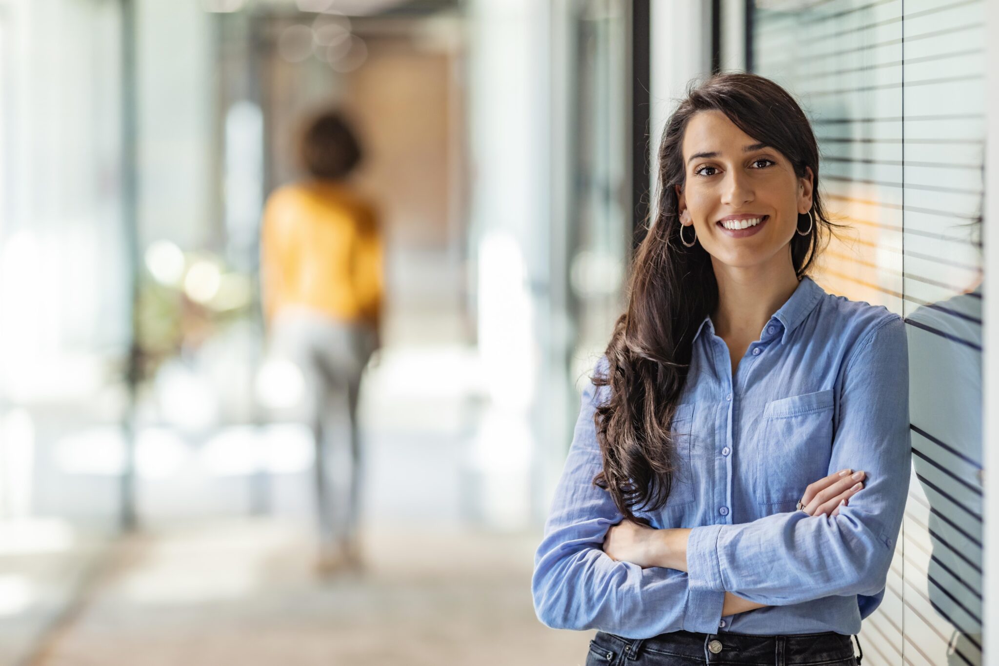 Confident business woman standing in professional office