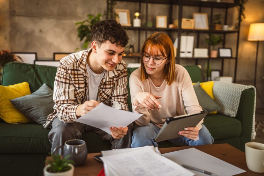 Young couple boyfriend and girlfriend or brother sister study at home