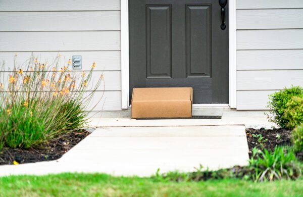 A package delivered to the front door of a house