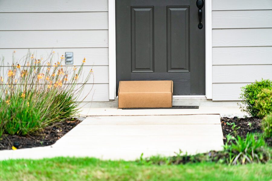 A package delivered to the front door of a house